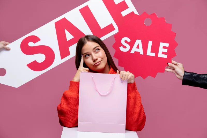 close up woman holding shopping bags 23 2149220711