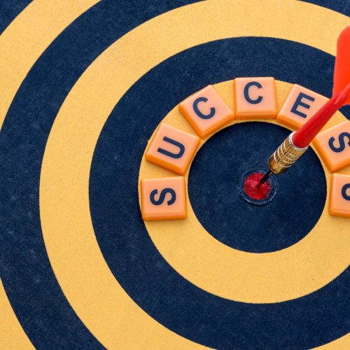 dart hitting bullseye target with word success dartboard 1357 74