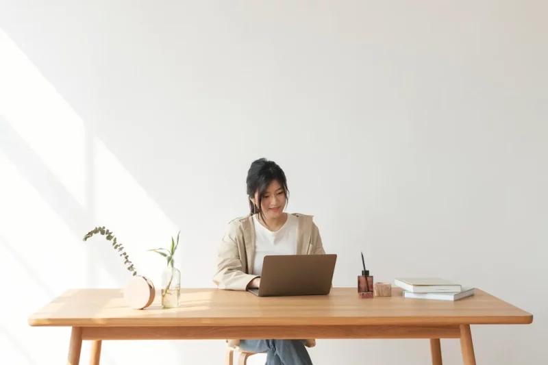 happy asian woman working from h