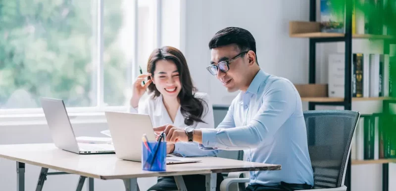 two asian businesspeople working