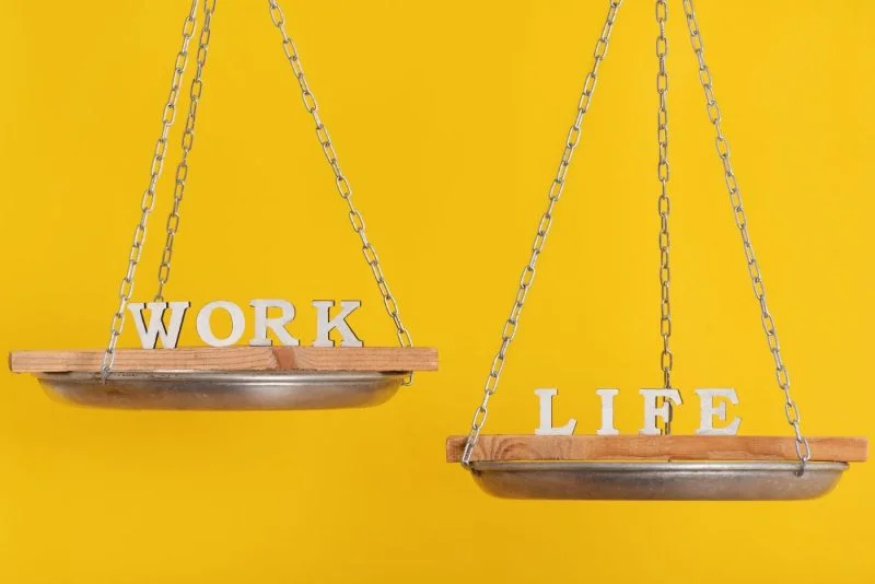 work vs life balance concept scales yellow background 1